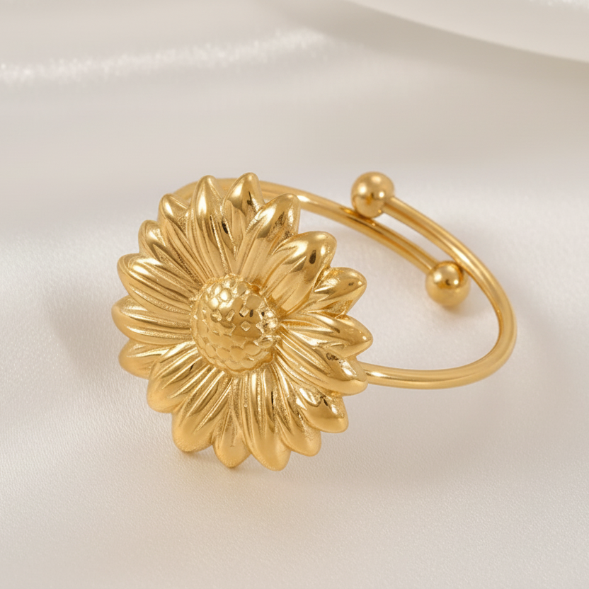 Bague ajustable en acier inoxydable doré, ornée d'une fleur marguerite.