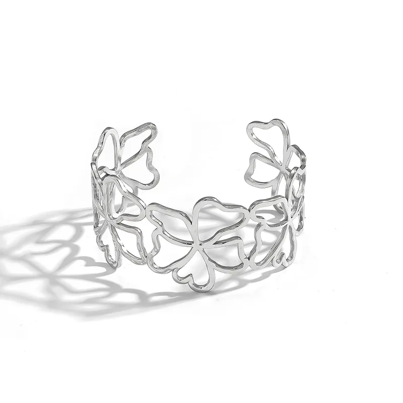 Bracelet manchette argenté en acier inoxydable avec fleurs ajourées