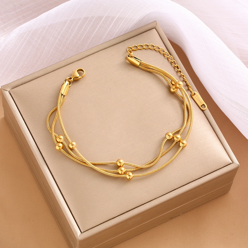 Bracelet femme doré en acier inoxydable 3 rangs fine maille serpent avec perles, style tendance