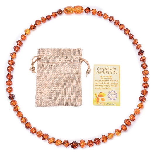 Collier en ambre orange pour bébé avec son certificat d'authenticité.