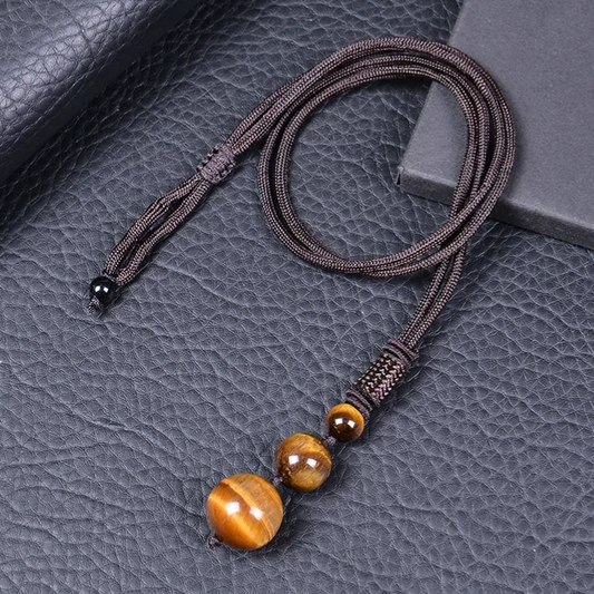 Pendentif trio en œil de tigre boules de 16, 12 et 8 mm avec cordon en nylon marron, bijou naturel.