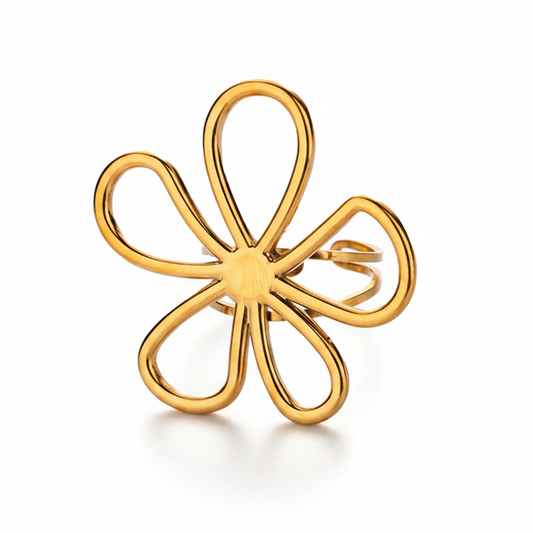 Bague en acier inoxydable doré, ornée d’une grande fleur ajourée.
