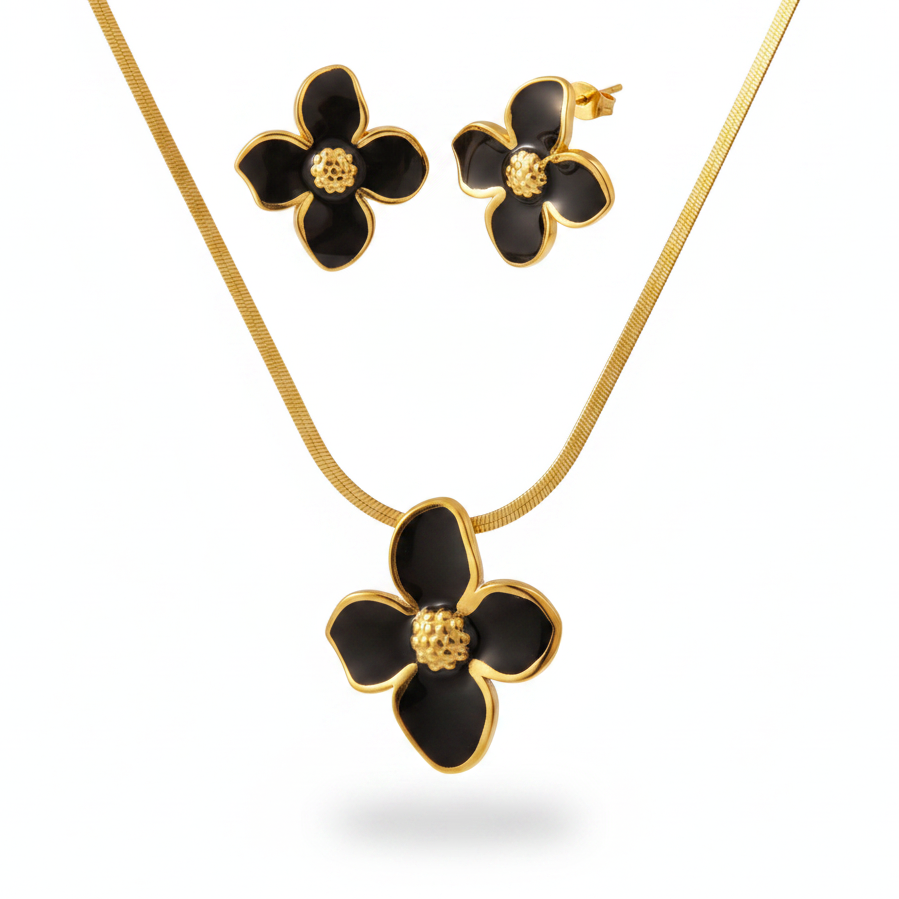 Parure à grande fleur émaillée noir en acier inoxydable doré composée d'un collier à maille serpent et boucles d'oreilles.