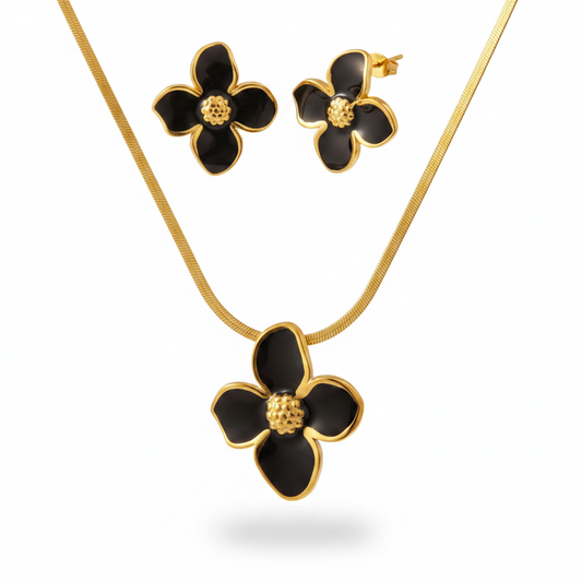 Parure à grande fleur émaillée noir en acier inoxydable doré composée d'un collier à maille serpent et boucles d'oreilles.
