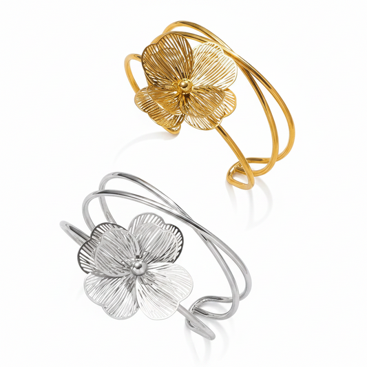 Bracelet manchette en acier inoxydable 316L doré et argenté, décoré d’une grande fleur stylisée.