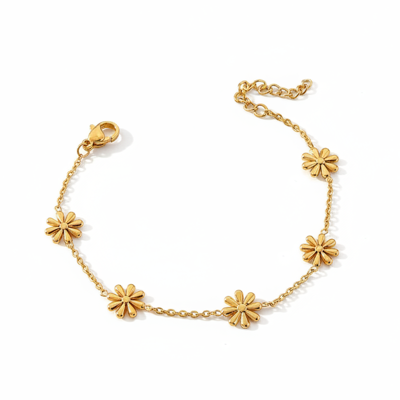 Bracelet doré en acier inoxydable 316L à chaîne fine ornée petites fleurs minimalistes.
