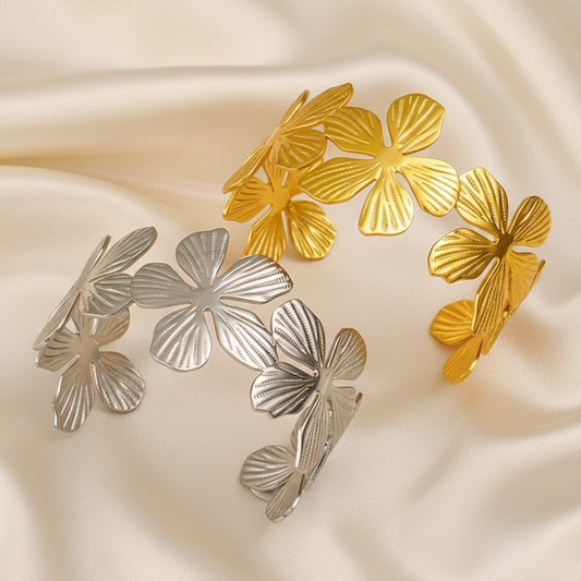 Bracelet manchette à larges fleurs en acier inoxydable 316L doré et argenté.