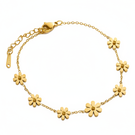Bracelet de chaville en acier inoxydable 316L doré à chaîne fine ornée de 7 petites fleurs délicates.