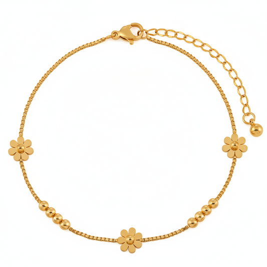 Bracelet de cheville en acier inoxydable 316L doré orné de 3 petites fleurs et 8 perles.