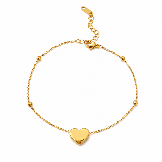 Bracelet de cheville en acier inoxydable 316L doré à chaîne fine décorée de 4 petites perles et d'un coeur.