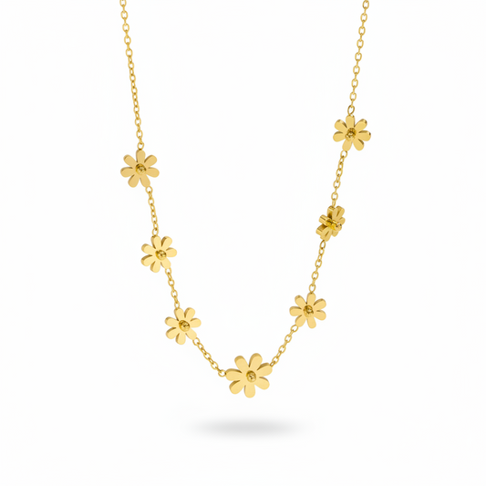 Collier en acier inoxydable  316L doré orné de 7 petites fleurs.