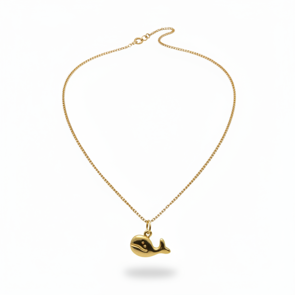 Collier enfant en acier inoxydable 316L doré, à chaîne fine maille gourmette et pendentif baleine.