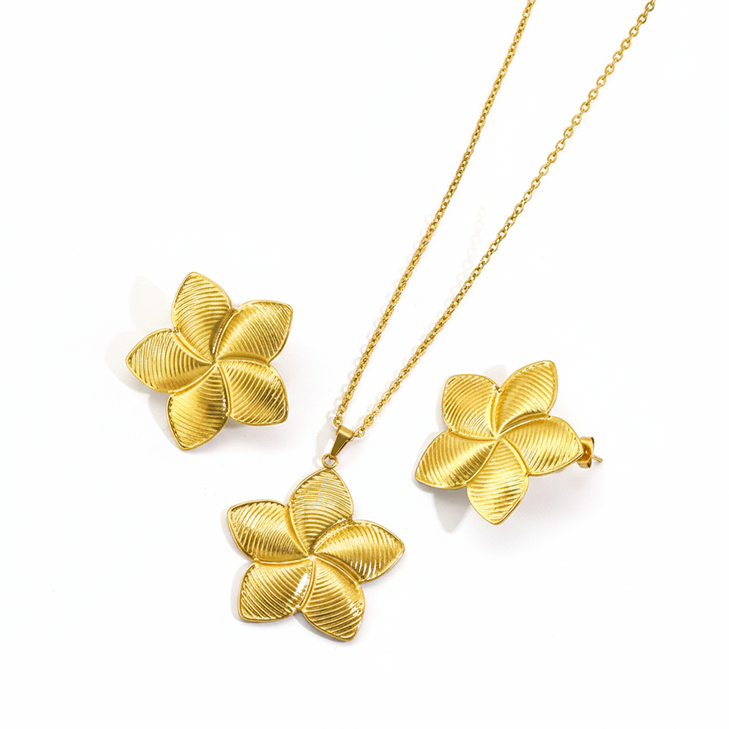 Parure grande fleur de tiaré comprenant un collier et des boucles d'oreilles en acier inoxydable doré.